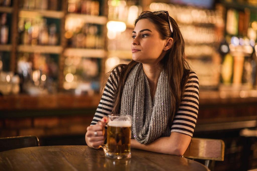 lonely-young-woman-sitting-in-a-bar-and-thinking-476027574-5890acd83df78caebc2a32f3